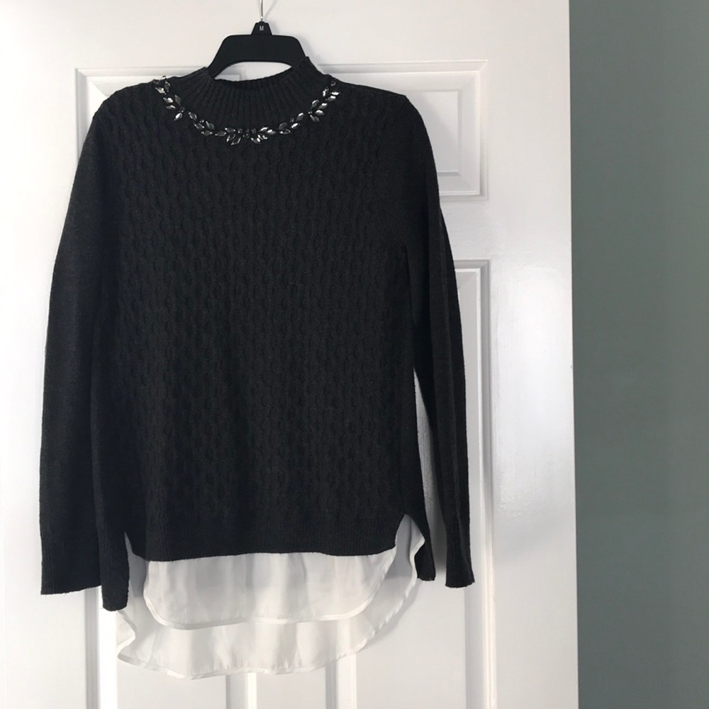 Sweater with crystal detail.